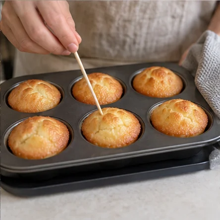 Step 5: Insert a wooden skewer into the center of one cake. It should come out without liquid batter; the cooked center is naturally dense and chewy. If still wet, bake another 3–5 minutes and check again. Do not eat underbaked batter.
